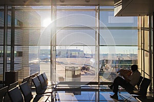 Passenger in the waiting room of the airport silhouette of a man