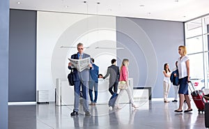 Passengers at airport wait for business class plain