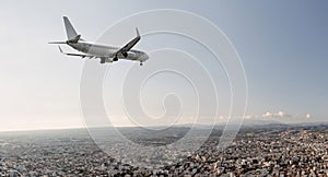 Passengers commercial airplane flying above Limassol city, Cyprus