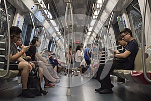 Passengers commute in the subway in Singapore