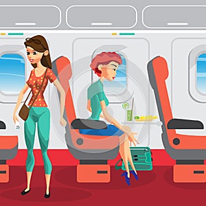 Passengers on the plane during the flight. Women are traveling.