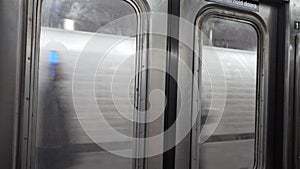 Passengers on platform of subway station in New York