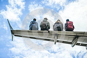 Passengers stranded on the wing of an airplane due to overbooking photo