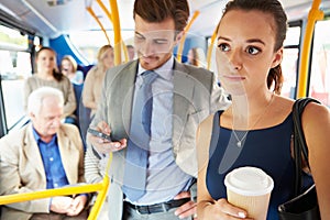 Passengers Standing On Busy Commuter Bus