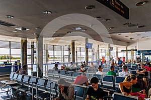 Passengers waiting in departure hall in Zadar International Airport for their flights home