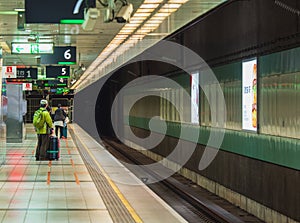 Passengers waiting for a train on platform at Taoyuan Taiwan High Speed Rail THSR station.