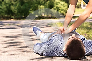 Passerby performing CPR on unconscious man