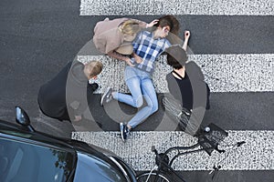 Passersby helping casualty of a car accident