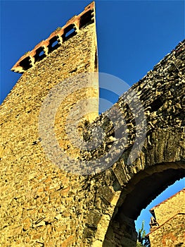 Passignano sul Trasimeno ancient town, Umbria region, Italy. History, tower, blue sky and time