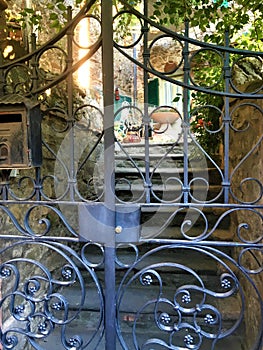 Passignano sul Trasimeno ancient town, Umbria region, Italy. Secret garden and gate
