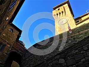 Passignano sul Trasimeno ancient town, Umbria region, Italy. Tower, clock, wall and history