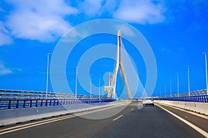 Passing the bridge La Pepa in CÃ¡diz during a sunny day with blue sky photo