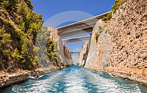 Passing through the Corinth Canal by yacht, Greece. The Corinth Canal connects the Gulf of Corinth with the Saronic Gulf