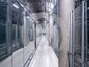 Passing daylight inside office building on modern glass building interior corridor