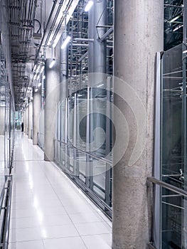 Passing daylight inside office building on modern glass building interior corridor