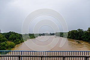 Passing over the bridge over river. The landscape of the river, the surface and the trees of the river\'s waterplain
