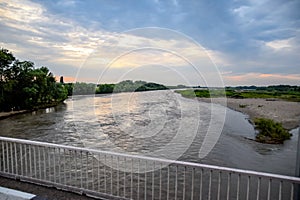 Passing over the bridge over river. The landscape of the river, the surface and the trees of the river\'s waterplain