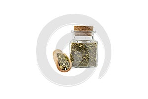 passion flower herb in latin - passiflora incarnata in wooden scoop and glass jar isolated on white background.