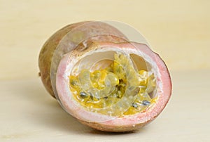 Passion fruit; Maracuja; passion-fruit isolated on wood photo