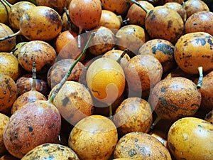 Passion fruit on display for sale in a traditional market, closed