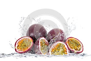 Passion fruit falling in water