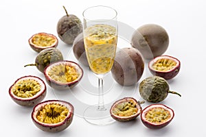 Passion Fruit Flesh In A Flute Amidst Cut Fruits