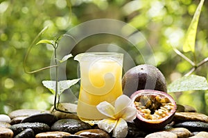 Passion fruit or passiflora edulis fruits and juices on nature background