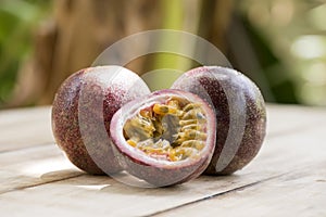 Passion fruit or passiflora edulis fruits on nature background