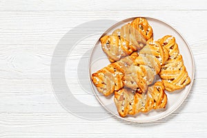 passion fruit puff pastry turnovers on a plate