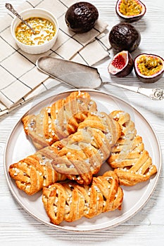 passion fruit puff pastry turnovers on a plate