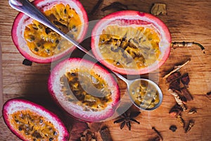 Passion fruit pulp and seed board, spoon, spices