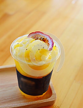 Passion fruit smoothies on wood