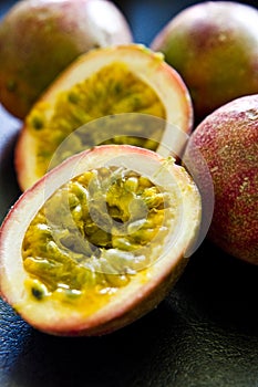 Passion fruit still life on black kitchen table