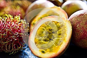 Passion fruit still life on black kitchen table