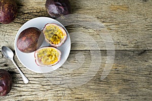 Passion fruit on white plate.