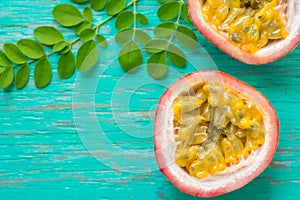 Passion fruits on wooden background,close up of fresh purple passion fruits harvest from farm,Half cut passion fruit.