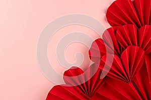 Passion love Valentine day background with red paper hearts of asian fans in modern fashion style on cute soft light pastel pink.