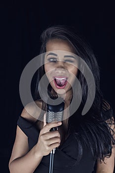 Passionate Black Female Singer with Microphone