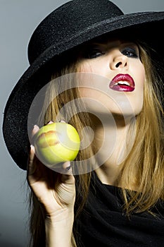 Passionate blonde girl with apple