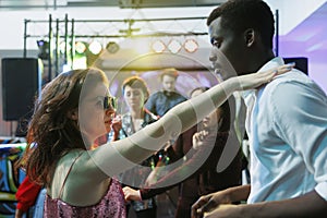 Passionate couple dancing at club party