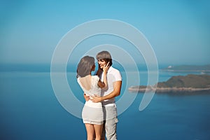 Passionate couple in love over sea and blue sky background. Enjo