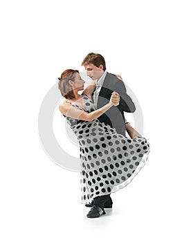 Passionate dancing couple on white background