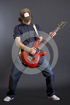 Passionate guitarist with hat