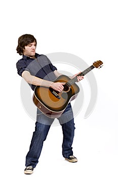 Passionate guitarist playing an acoustic guitar