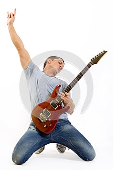 Passionate guitarist playing his electric guitar