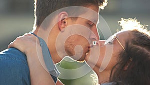 Passionate love couple kissing on a summer day.