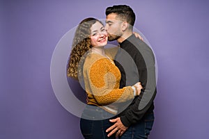 Passionate man kissing his girlfriend