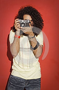 Passionate photographer long curly hair holding camera