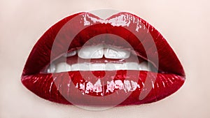 Passionate red lips. Opened mouth. Beautiful makeup close up.