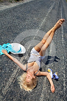 Passionate woman lying on road